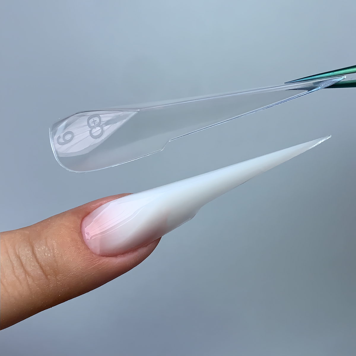 C14 mechanical claw nail forms with structured robotic lines, close-up view