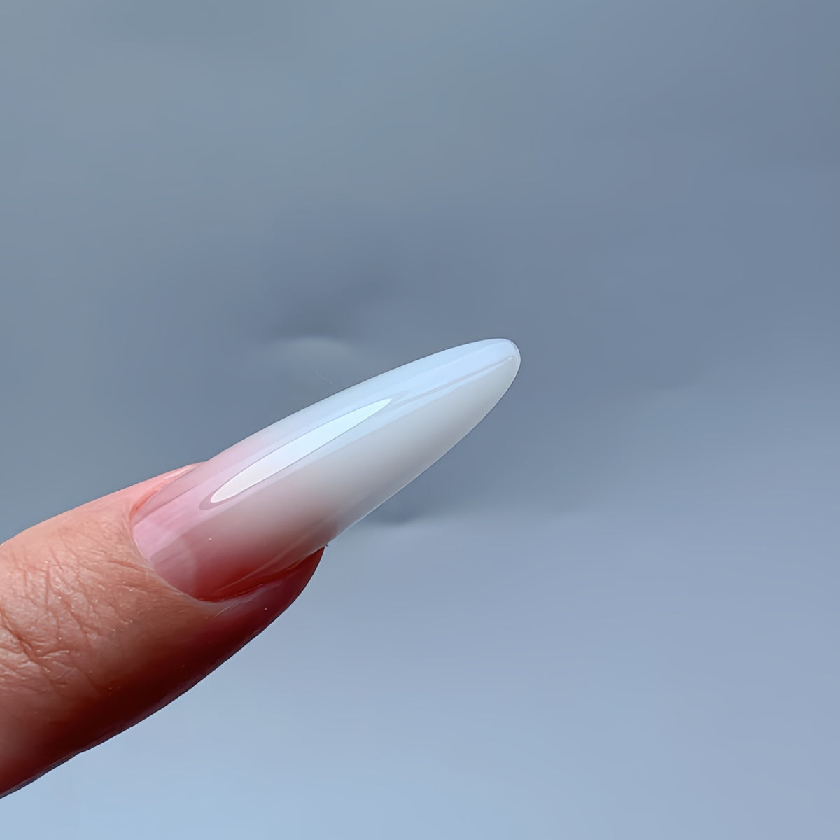 Close-up view of finished 3.5 cm almond nail extension sculpted with COZURU C29 dual forms