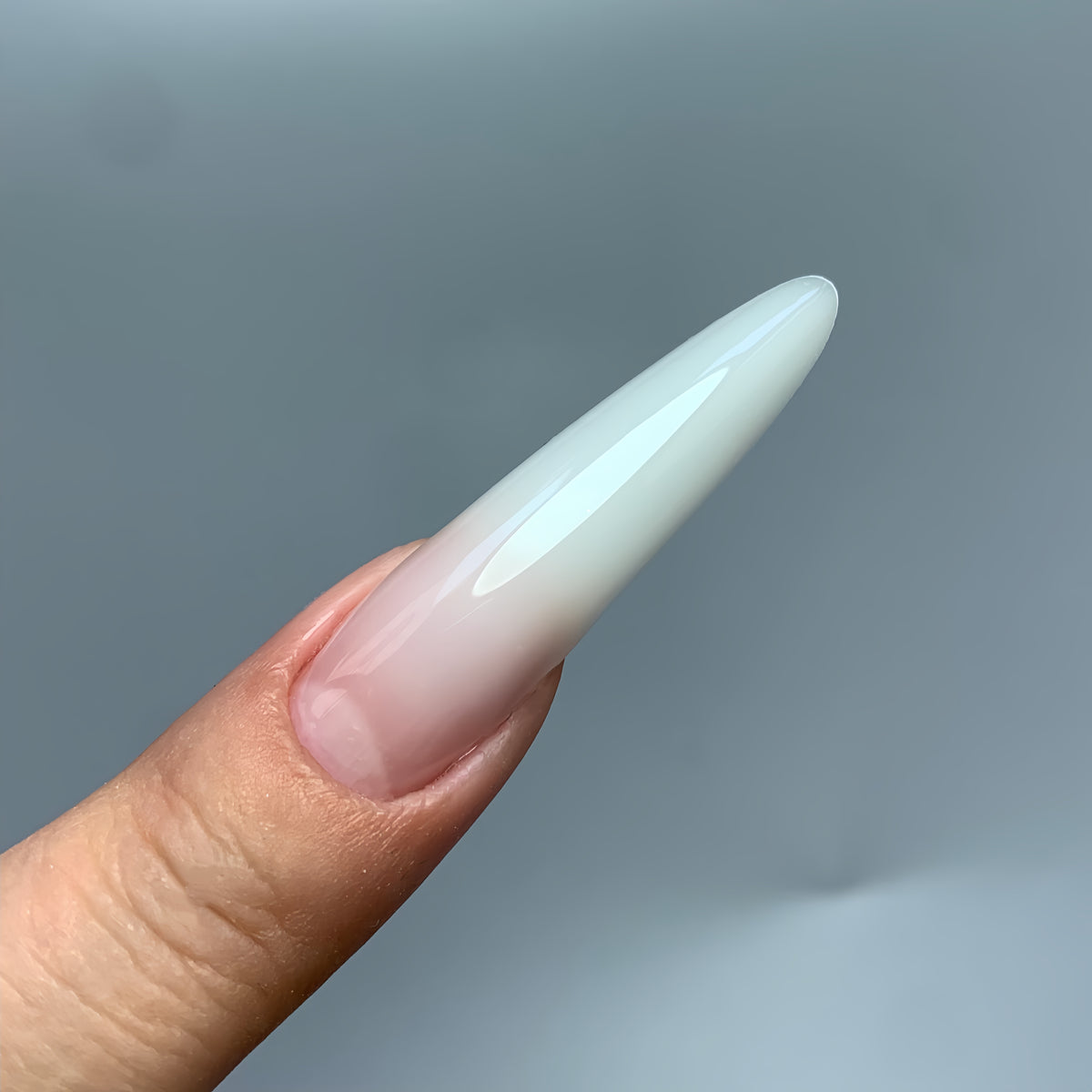 Elegant medium almond gel nails made with COZURU C05 forms