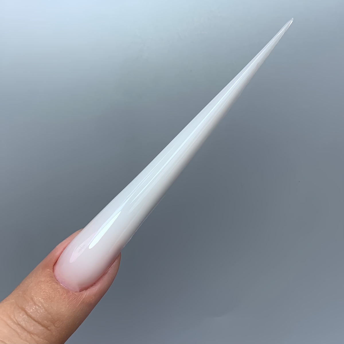 Asymmetric Ferrari gel nails made with COZURU C13 forms