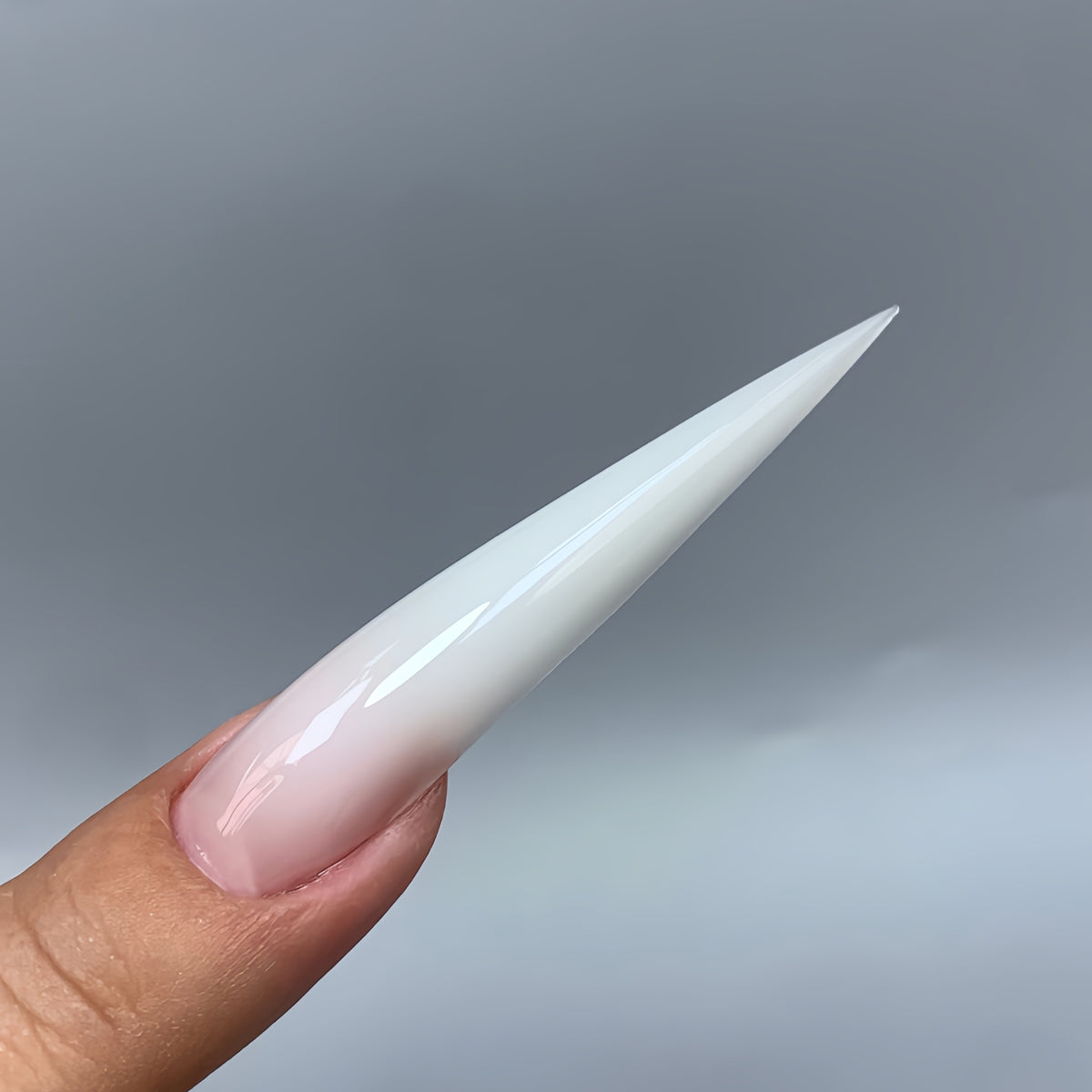 Dramatic extra long stiletto gel nails made with COZURU C16 forms