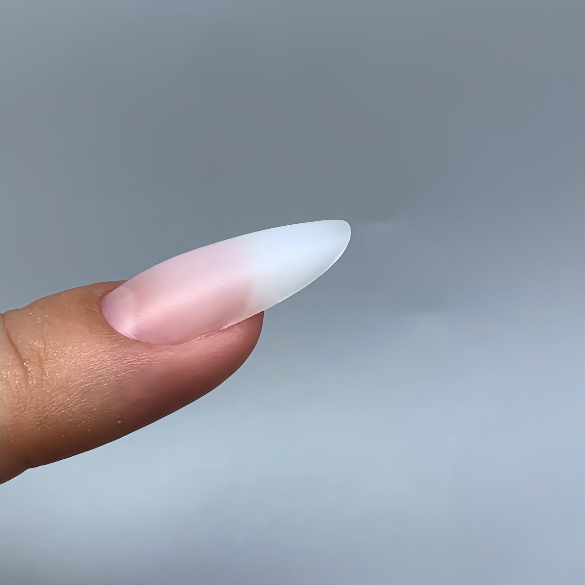 Side profile of oval nail extension with natural apex made with COZURU C17 dual forms