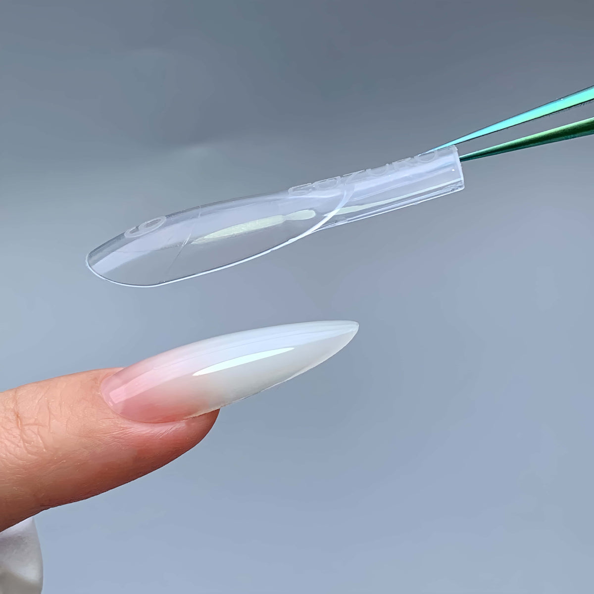 Side angle of COZURU C29 3.5 cm almond dual form showing natural apex curve and finished gel nail