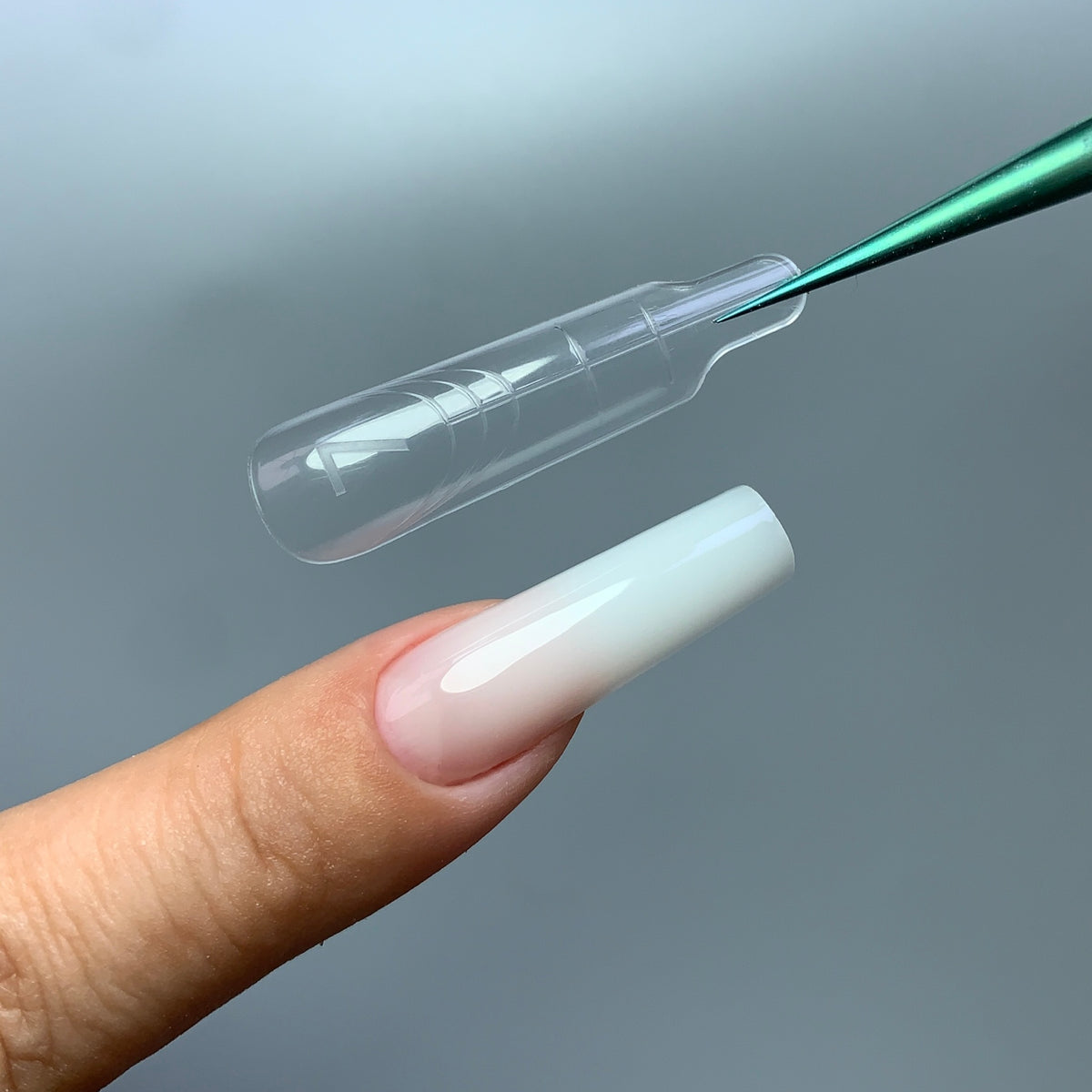 C02 short square nail forms with clear reusable design, close-up view
