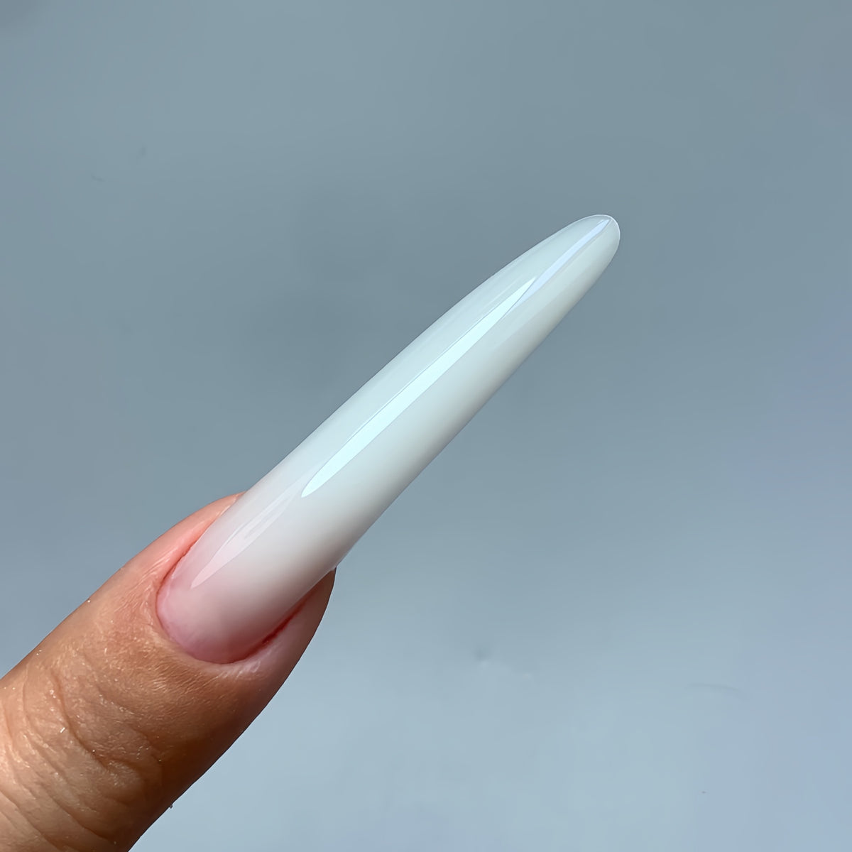 Elegant long oval gel nail extensions made with COZURU C03 forms