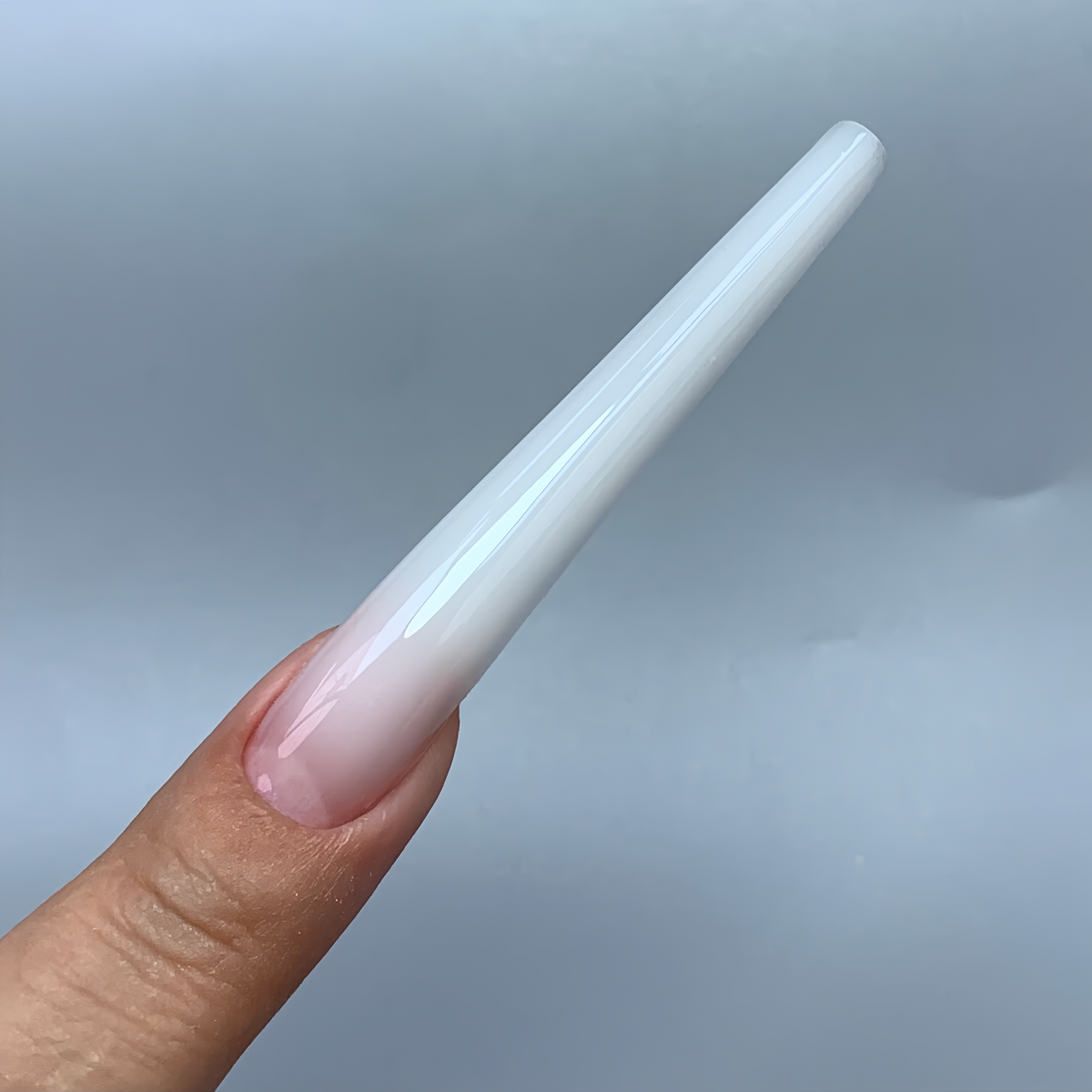 Slender tapered gel nails that lengthen fingers, made with COZURU C10 forms