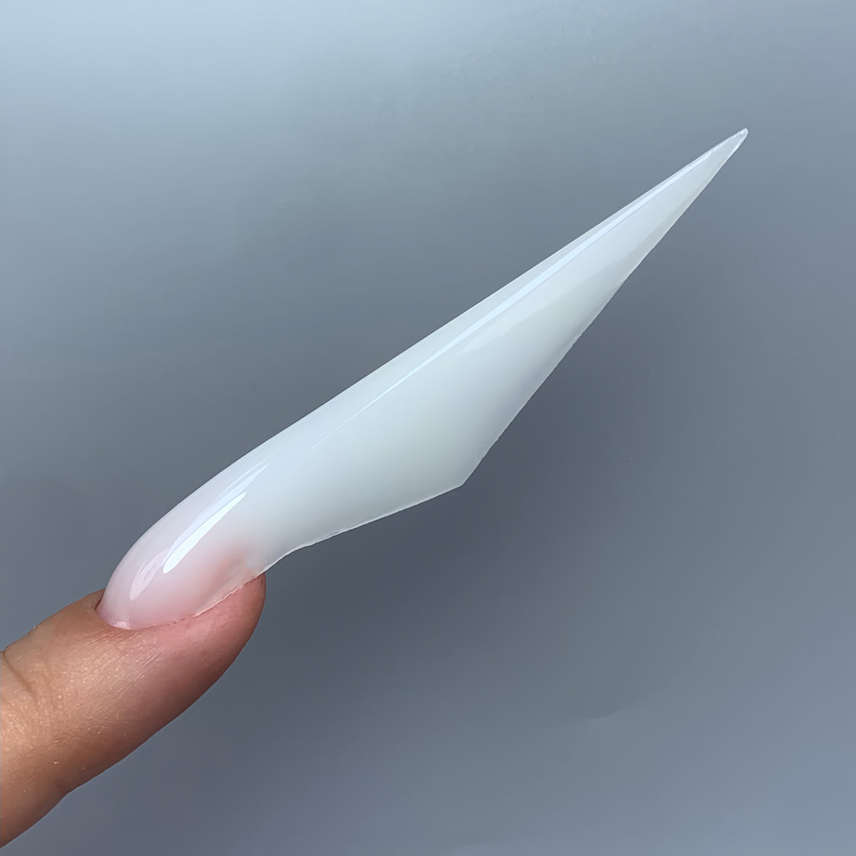Side view of a finished Irregular Ferrari nail made with COZURU C13 forms